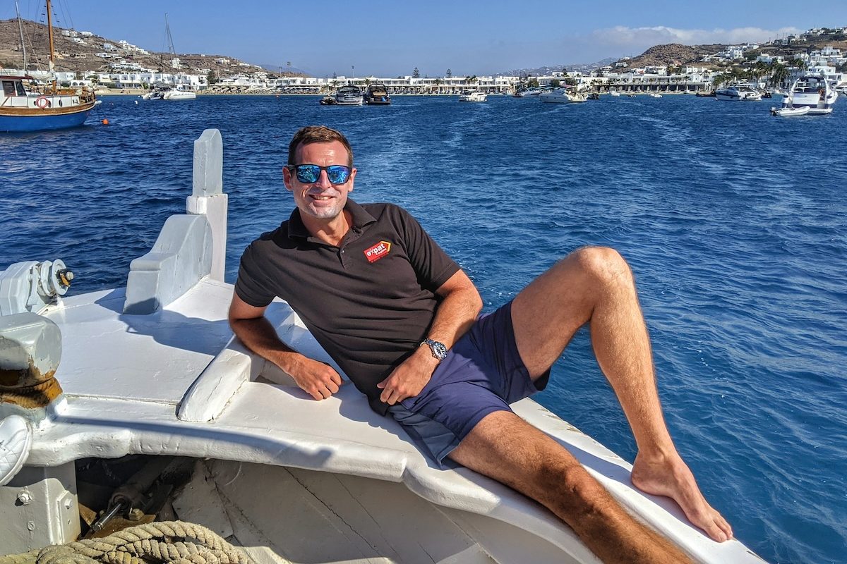 Tour leader enjoying a boat cruise around the coast of Mykonos
