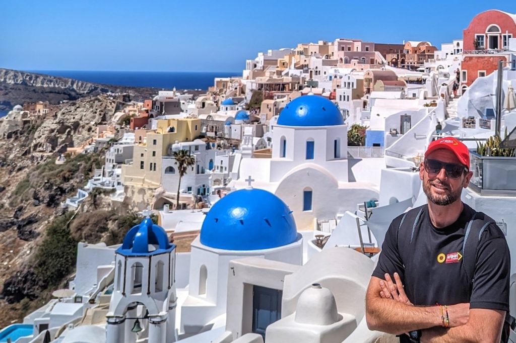 Author of Best of Greece tour review standing in Oia, Santorini