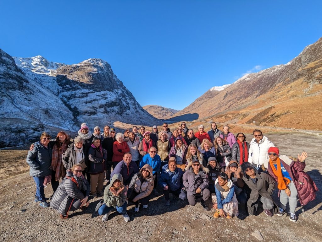 Best of UK & Ireland tour review - Expat Explore group photo at the Three Sister's Viewpoint in Glencoe