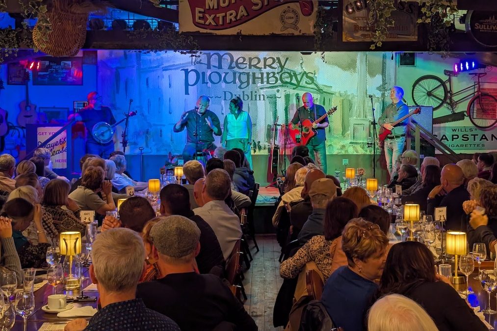 Best of UK & Ireland tour review - An Expat Explore group member on stage at the Merry Ploughboy