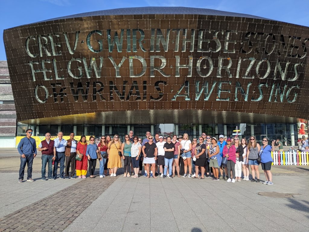 Best of UK & Ireland tour review - Expat Explore group photo in front of the Millennium Centre in Cardiff, Wales