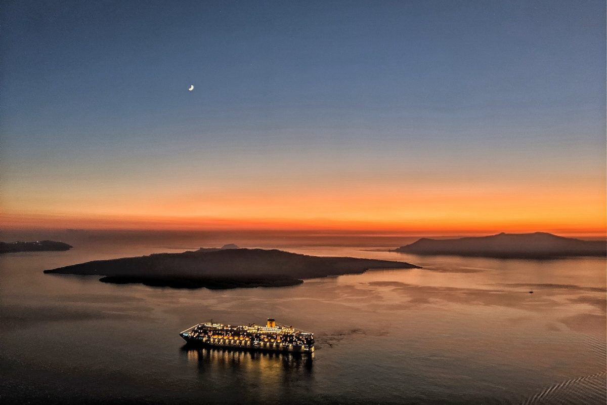 Santorini travel guide - view from Fira after sunset